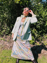 Women's vintage 1970's sleeveless ankle length maxi dress. Nightgown loungewear style with an all over pink, green, and blue pastel colored print.