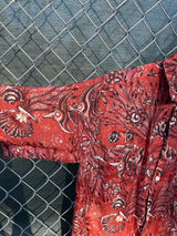 Men's vintage 1950's/1960's Leonardo label short sleeve button up rayon shirt in brown color with all over fish and seashell print.