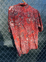 Men's vintage 1950's/1960's Leonardo label short sleeve button up rayon shirt in brown color with all over fish and seashell print.