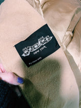 Women's vintage 1970's Domino, New York label long sleeve knee length light tan camel colored wool coat with brown genuine fur trim around collar and cuffs.