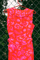 Women's vintage 1970's Liberty House for Lila Honolulu label sleeveless ankle length jumpsuit in a vibrant pink and orange Hawaiian print.