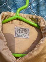 Men's vintage 1950's H Bar C Ranchwear, Long Tail label long sleeve western shirt in satin yellow color with pearly snap buttons.