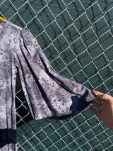 Women's vintage 1970's short length short sleeve grey printed dress with big bell sleeves in a cotton material.