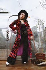 Women's vintage 1970's Dynasty label long sleeve long length velvet material puffy duster jacket in black, purple, and pink colors.