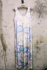 Women's vintage 1970's sleeveless ankle length maxi dress. Nightgown loungewear style with an all over pink, green, and blue pastel colored print.