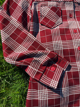 Women's vintage 1970's Montgomery Ward label long sleeve button up polyester shirt blouse in maroon and cream colored checkers.