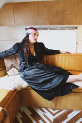 Women's vintage 1990's Blanche label long sleeve maxi length black wrap duster robe. Has lace and ruffle trim. Lightweight Polyester material.