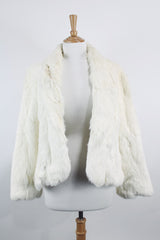 Women's vintage 1970's Wilsons Suede & Leather, Made in Korea label long sleeve bright white genuine fur coat with one hook and eye closure in the front.