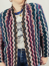 Women's vintage 1980's Graff Petite, Made In USA label long sleeve open front nubby acrylic cardigan sweater with a multicolored zig zag print.