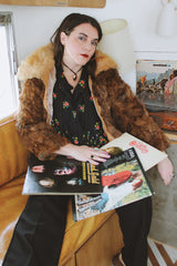 Women's vintage 1980's Dino Ricco, Made in Hong Kong label long sleeve zip up brown genuine fur coat with cream fur neckline.