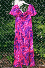 Women's vintage 1970's Penneys Hawaii label short sleeve maxi length dress with an all over pink and purple Hawaiian print.