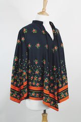 Women's vintage 1970's. Montgomery Ward label long sleeve black tunic blouse with a tie front neck and triangle shaped hem.