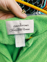 Women's vintage 1980's David Brown for Saks Fifth Avenue short sleeve mini length zip up towel material dress in a vibrant lime green and printed pink trim.