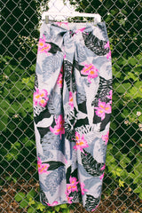 Women's vintage 1980's Helena's, Made in Hawaii label midi length wrap skirt in grey and black with pink Hawaiian floral print. Great as swimsuit cover up.