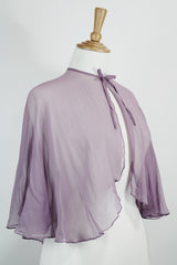 Women's vintage 1980's sheer silk material cape blouse in a light purple color. Has one hook and eye closure at neck with attached bow.