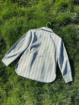 Women's vintage 1970's long sleeve button up shirt blouse in green and white printed polyester material.