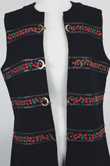 Women's vintage 1970's Palena Knitwear, Made in Hong Kong label sleeveless black wool vest with brass buckles closures up the front and floral trim details.