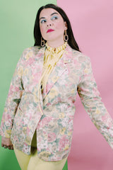 Women's vintage 1980's Elizabeth Williams, Made in USA label long sleeve floral print blazer with one button closure. All over pink, yellow, and tan flowers.
