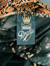 Women's vintage 1990's High Drama label long sleeve cropped fit open front velvet top with an all over black and gold snakeskin print.