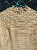 Women's vintage 1970's Maggi label long sleeve short length cream colored crochet dress with lace trim and mock neck.