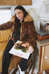 Women's vintage 1980's Dino Ricco, Made in Hong Kong label long sleeve zip up brown genuine fur coat with cream fur neckline.