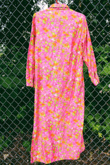 Women's vintage 1970's Bellariva label long sleeve ankle length button up shirt dress with collar. All over pink and orange floral print.
