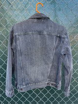 Women's Levi's black grey wash long sleeve button up lightweight jacket with brass hardware and pockets.