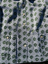 Women's vintage 1970's short sleeve button up shirt blouse in green and white print in polyester material.