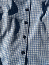 Women's vintage 1970's matching pant set with pants and button up shirt blouse in blue and white gingham polyester material.