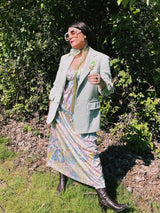 Women's or men's vintage 1970's JCPenny label long sleeve blazer in polyester material. Has a all over light green and white houndstooth print.