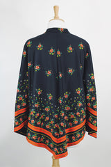 Women's vintage 1970's. Montgomery Ward label long sleeve black tunic blouse with a tie front neck and triangle shaped hem.