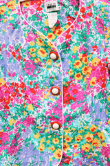 Women's vintage 1980's Leslie Fay matching set in an all over multicolored ditsy floral print. Short sleeve blazer jacket and midi pencil skirt.