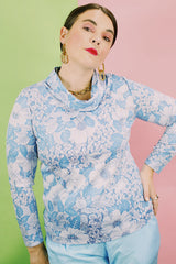 Women's vintage 1970's Graff Californiawear label long sleeve top with a cowl neck and all over blue floral print.