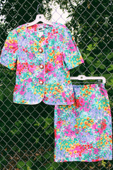 Women's vintage 1980's Leslie Fay matching set in an all over multicolored ditsy floral print. Short sleeve blazer jacket and midi pencil skirt.