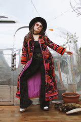 Women's vintage 1970's Dynasty label long sleeve long length velvet material puffy duster jacket in black, purple, and pink colors.