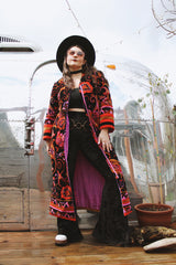 Women's vintage 1970's Dynasty label long sleeve long length velvet material puffy duster jacket in black, purple, and pink colors.