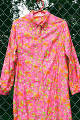 Women's vintage 1970's Bellariva label long sleeve ankle length button up shirt dress with collar. All over pink and orange floral print.
