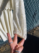 Women's vintage 1970's Union Made long sleeve midi length dress in cream white polyester with lace top and sleeves.