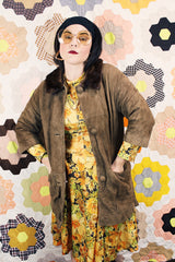 Women's vintage 1960's Emerald Fine Fashions label 3/4 arm length long tan suede mod style jacket with genuine fur trim around neck.