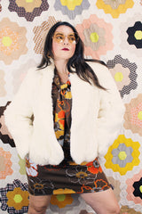 Women's vintage 1970's Wilsons Suede & Leather, Made in Korea label long sleeve bright white genuine fur coat with one hook and eye closure in the front.