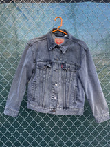 Women's Levi's black grey wash long sleeve button up lightweight jacket with brass hardware and pockets.