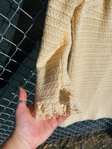 Women's vintage 1970's Maggi label long sleeve short length cream colored crochet dress with lace trim and mock neck.