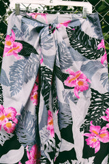 Women's vintage 1980's Helena's, Made in Hawaii label midi length wrap skirt in grey and black with pink Hawaiian floral print. Great as swimsuit cover up.