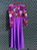 Women's vintage 1970's long sleeve maxi length dress in purple and multicolored floral print in polyester material.