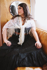 1970's cream colored lace triangle shaped scarf with long fringe trim that can also be worn as a shawl.