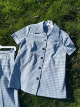 Women's vintage 1970's matching pant set with pants and button up shirt blouse in blue and white gingham polyester material.