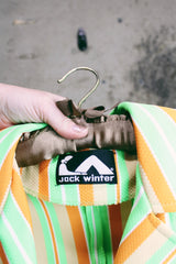 Women's vintage 1970's Jack Winter label long sleeve striped blazer with gold button closure. Lime green, orange, and tan colors in polyester material.