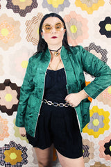 Women's vintage 1960's reversible long sleeve satin smoking jacket. Green on one side and cream on the other. Fabric buttons.