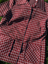 Women's vintage 1970's matching pant set with pants and a short sleeve button up shirt in maroon and white checkered print.
