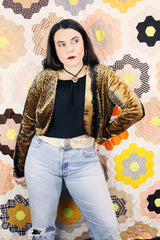 Women's vintage 1990's High Drama label long sleeve cropped fit open front velvet top with an all over black and gold snakeskin print.